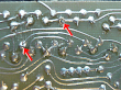 thumbnail image of close up of two cold solder joints on a circuit board