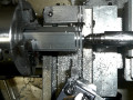 thumbnail photo of new hub being made on a lathe, with the old one behind it