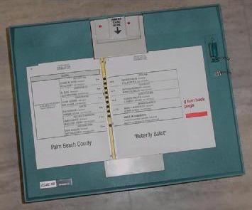  [photo of a Votomatic voting machine] 